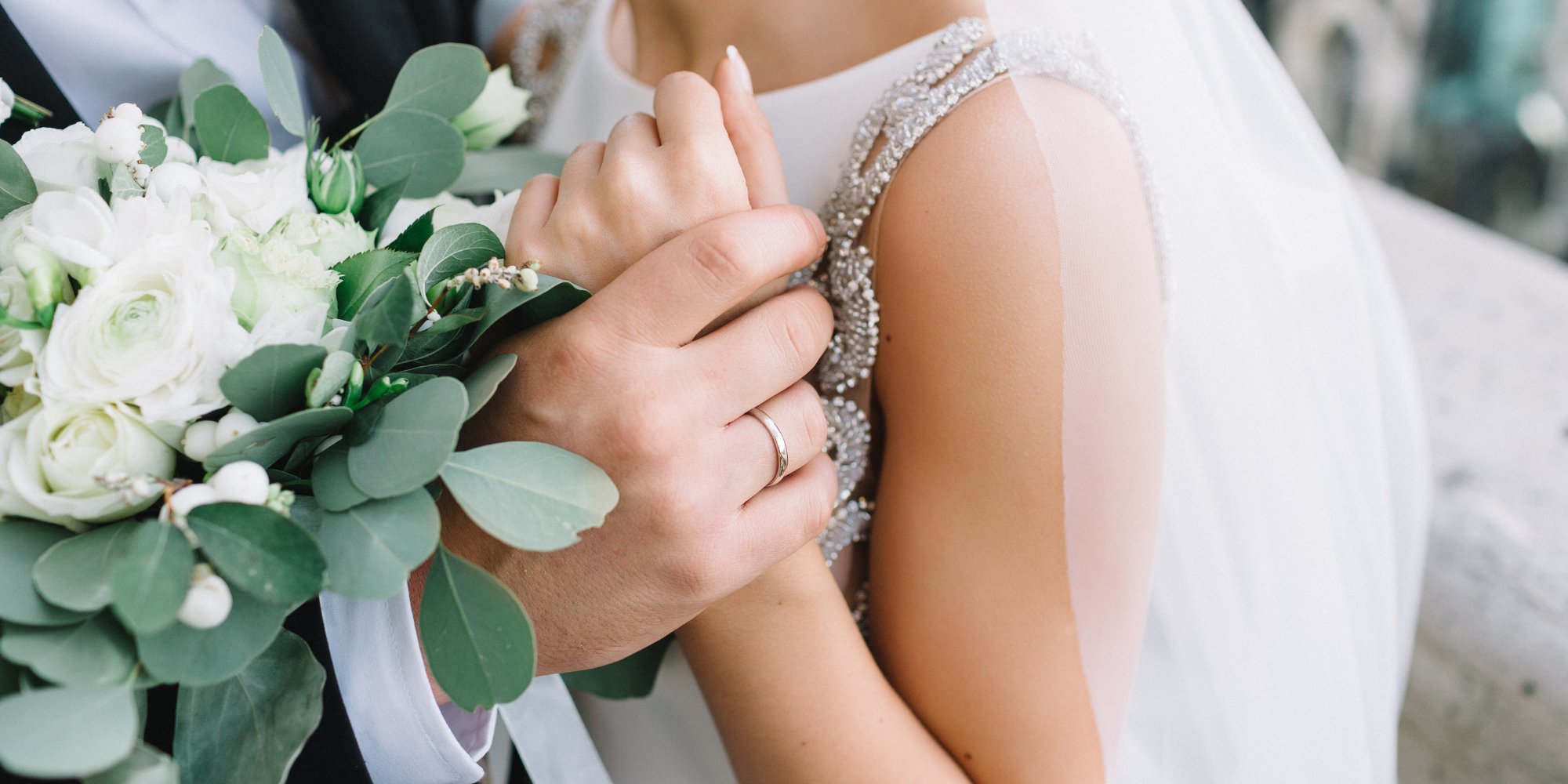 Wedding couple holding hands